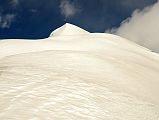 12 Staring Up At The Expansive Snow Field To The Summit Of Chulu Far East From Col Camp